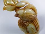 a bird that is sitting on top of a vase