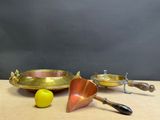 brass plate with a spoon and a lemon on a wooden table