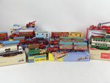 many different types of toy trains and trucks on the table