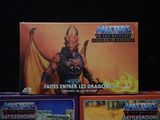 three boxes of masters of the universe battlegrounds sit on a table