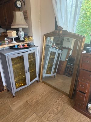 a large mirror in the corner of the room