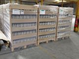 several pallets of bottled water are stacked on pallets in a warehouse