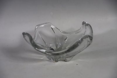 a glass bowl that is sitting on a table