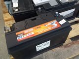 many different types of batteries sitting on a pallet