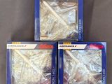 trois boîtes de maquettes d'avions Air France posées sur une table