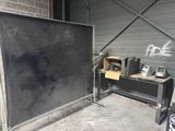 a blackboard on a table in front of a blackboard
