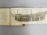 an open book with a drawing of a boat on it