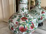 two vases that are sitting on a marble table