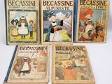 quatre livres pour enfants sont alignés sur une surface blanche
