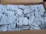 a cardboard box filled with a lot of clothes