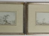 two framed drawings of trees and a river in a gold frame