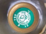 a close up of a bottle of wine with a cork in it