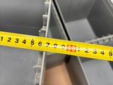 a measuring tape on the bottom of a metal container