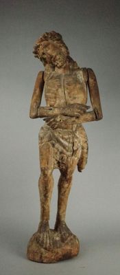 an image of a statue of a man holding a knife