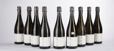six bottles of wine lined up in a row on a table