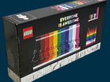 a box of legos sitting on a blue surface