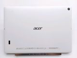 the back of a white tablet computer sitting on top of a white table
