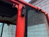 a close up of a red door on a bus