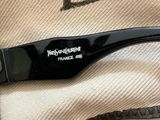chanel sunglasses with a black plastic frame and a black logo on the side