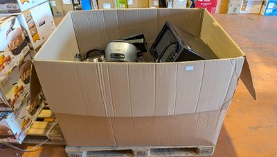 a cardboard box with a microwave in it in a store
