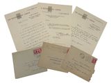 several old letters and envelopes sitting on top of each other