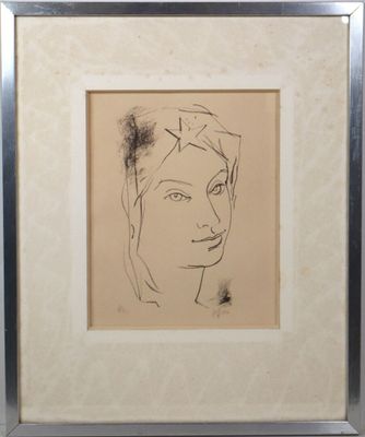 drawing of a woman ' s face in a frame on a wall