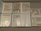 a lot of different stamps on the pages of a book