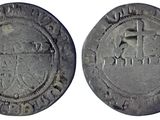 une pièce d'argent sur laquelle figure l'image d'un homme