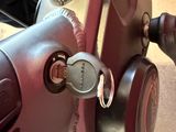 a close up of a bike with a lock on it