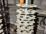 a machine that has gears attached to it in a garage