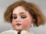 a close up of a doll with a very long hair