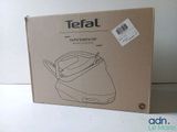 a box with a black and white picture of a tea kettle