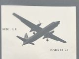 a black and white photo of an airplane flying in the sky