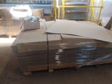 a large stack of boxes sitting on a pallet in a warehouse