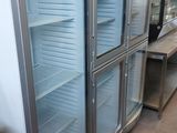 several glass doors that are open in a room