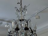 a chandelier hanging from the ceiling in a room