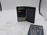 a calculator and a book sitting on a table