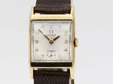 an image of a gold plated wrist watch with a brown leather strap