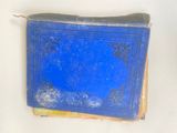 a blue book sitting on top of a wooden table
