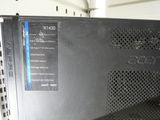 a close up of a laptop computer on a shelf