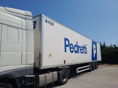 a semi truck that is parked on the side of the road