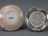 two plates with a map on them sitting next to each other
