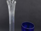 two vases that are sitting next to each other on a table
