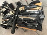many umbrellas that are on a table in a room