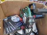 a box full of tools that are sitting on the ground