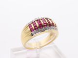 a yellow gold ring set with rubies and diamonds