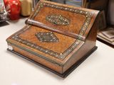 a small wooden box sitting on a counter in a room