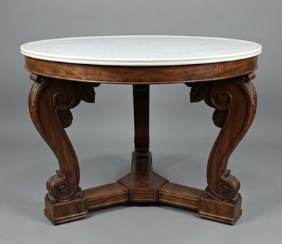a round marble top table on a wooden base