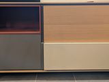 a wooden cabinet with two different colors on it