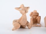 three figurines that are sitting next to each other